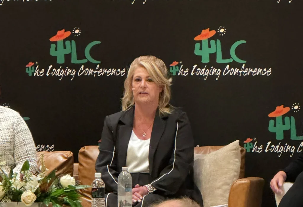 a woman sitting in a chair with a microphone in front of her